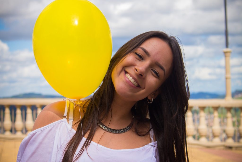 happy woman smiling balloon