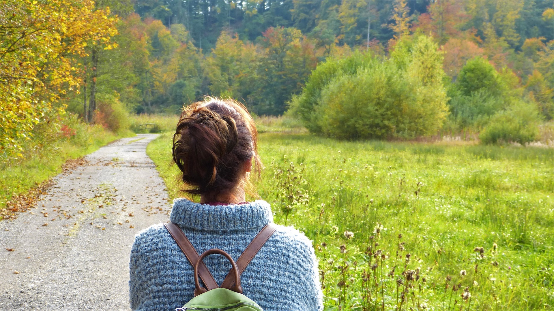 woman with backpack long road ahead journey