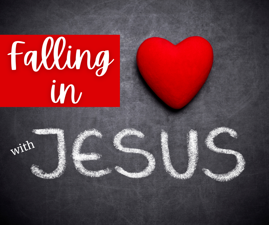 falling in love with jesus written on a chalk board with red heart